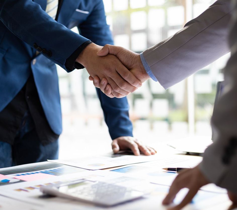 Business partner handshake after the meeting. Financial and investment cooperation.