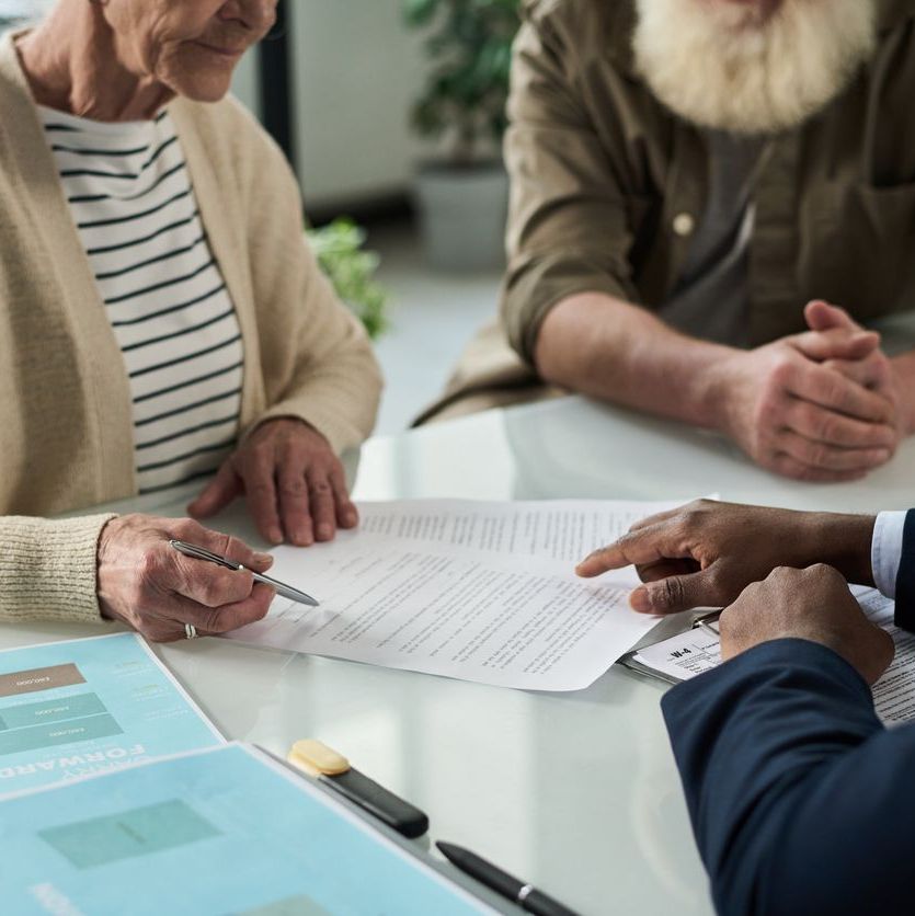 Senior Couple Signing Documents